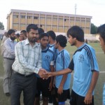 Chief Guest M. Jaffer shake hand with Man of the Match Shoaib Ahmed of Baloch Youth